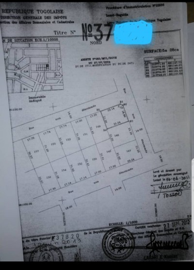 1 lot cloturé avec titre foncier sur 2 voies ( centre aéré BCAO )