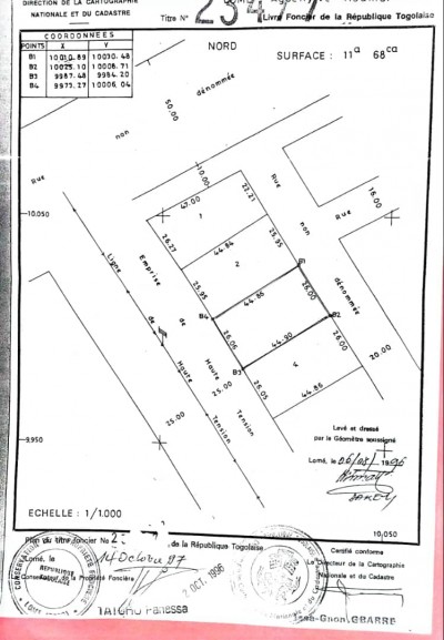2 lots collés cloturés avec titre foncier au bord du goudron