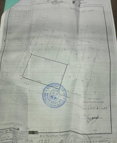 4 lots collés cloturés avec titre foncier à 200m du goudron