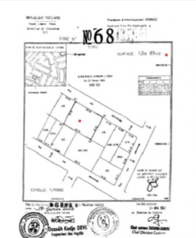 2 lots collés cloturés avec titre foncier à 200m du goudron