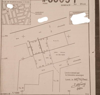 1 lot cloturé avec titre foncier au bord du goudron