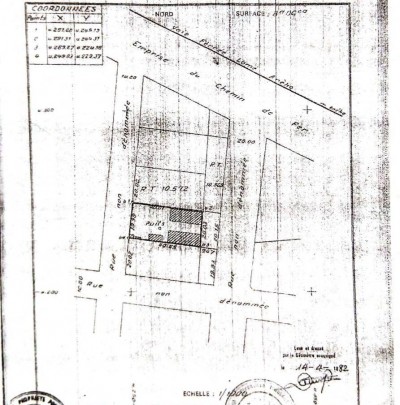 1 lot et démi avec titre foncier à 100m du goudron