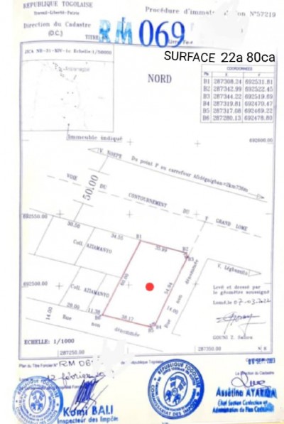 3 lots 3/4 collés cloturés avec titre foncier au bord du goudron