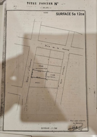 1 lot cloturé avec titre foncier au bord des pavés à dékon