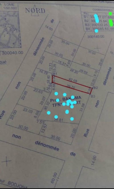 1 lot et démi avec titre foncier global à 80m du goudron