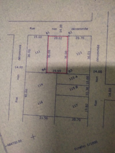 1 lot 1/4 cloturé avec titre foncier à 30m du goudron