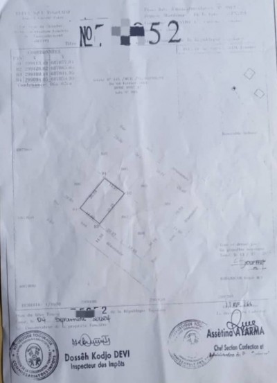 1 lot cloturé avec titre foncier à 150m du goudron