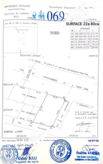 4 lots collés cloturés avec titre foncier au bord du goudron