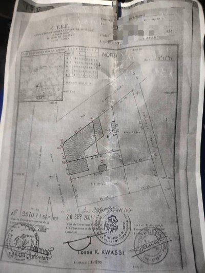 1 lot et démi avec titre foncier au grand marché assigamé