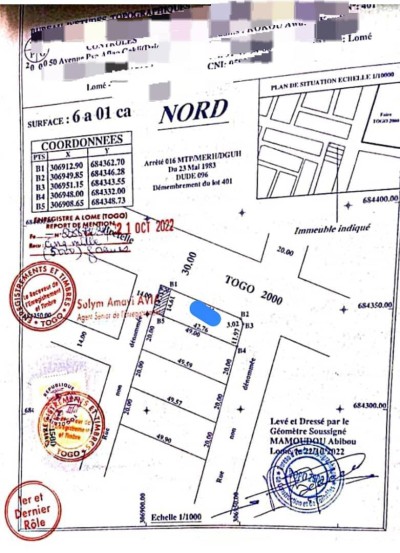 1 lot avec titre foncier en cours au bord du goudron