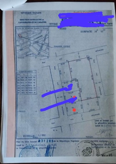 1 lot avec titre foncier tout proche de  l'etat civil
