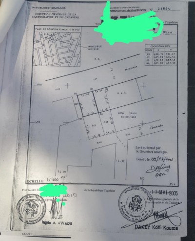 1 lot cloturé avec titre foncier  au bord de la grande voie