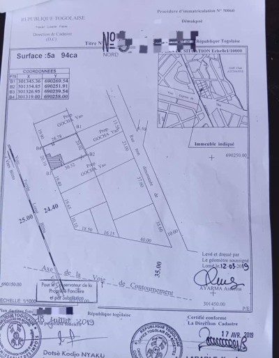 1 lot cloturé avec titre foncier à 100m du goudron