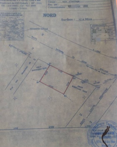 1 lot cloturé avec plan + mandat  en bordure du goudron