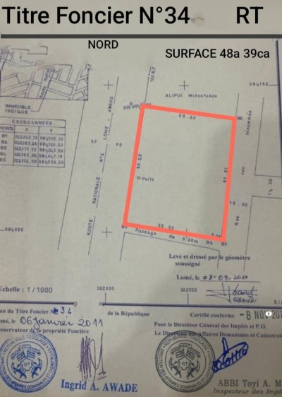 8 lots collés cloturés avec titre foncier au bord du goudron