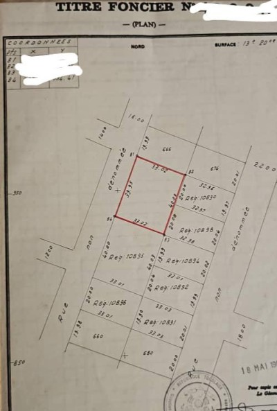 2 lots 1/4 cloturés avec titre foncier à 50m du goudron