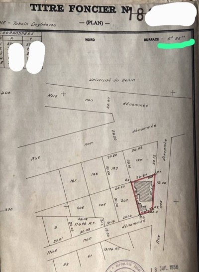 1 lot cloturé avec titre foncier à 50m des pavés