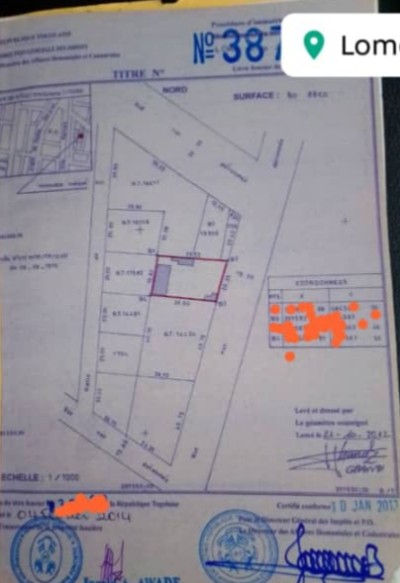 1 lot cloturé avec titre foncier  à 100m de l'école madone